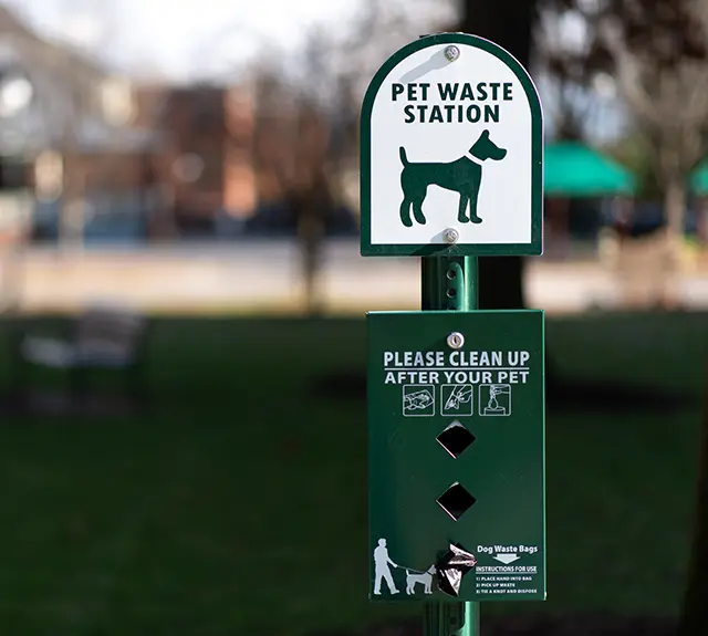 Pet waste station in a community park